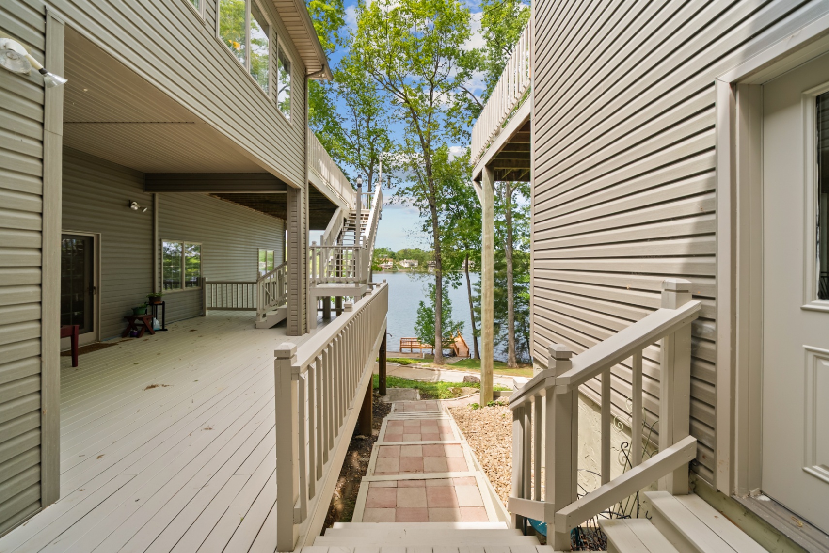 Walkway between deck levels leading down toward the lake