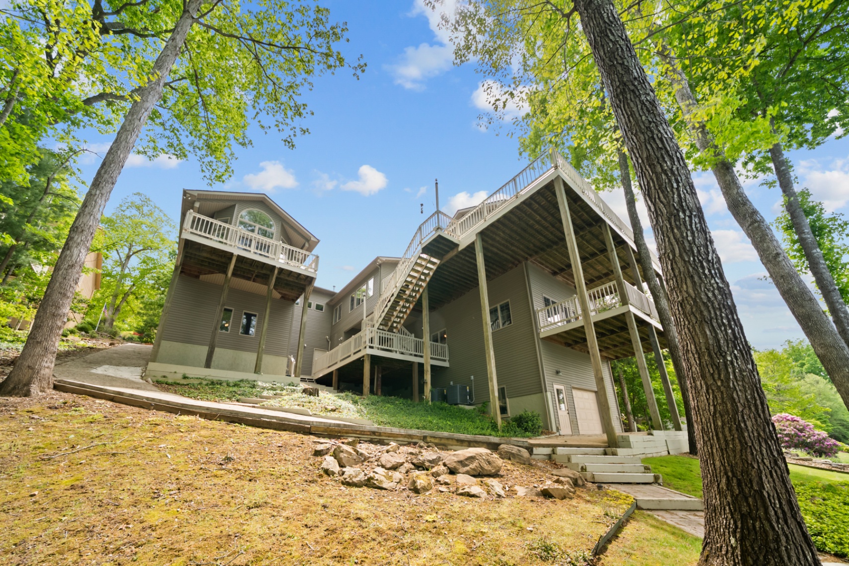 Full rear elevation showing the home’s multi-level deck system