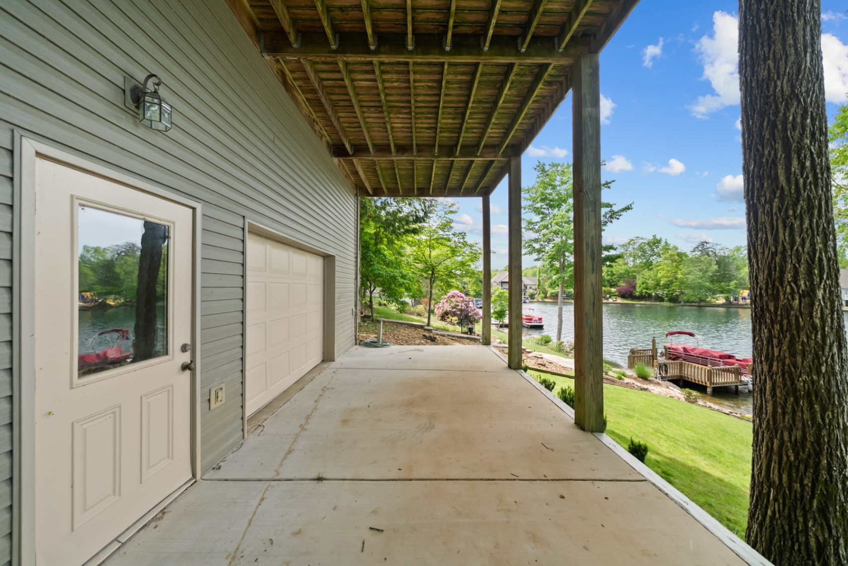 Rear-facing single garage bay for lake equipment and storage