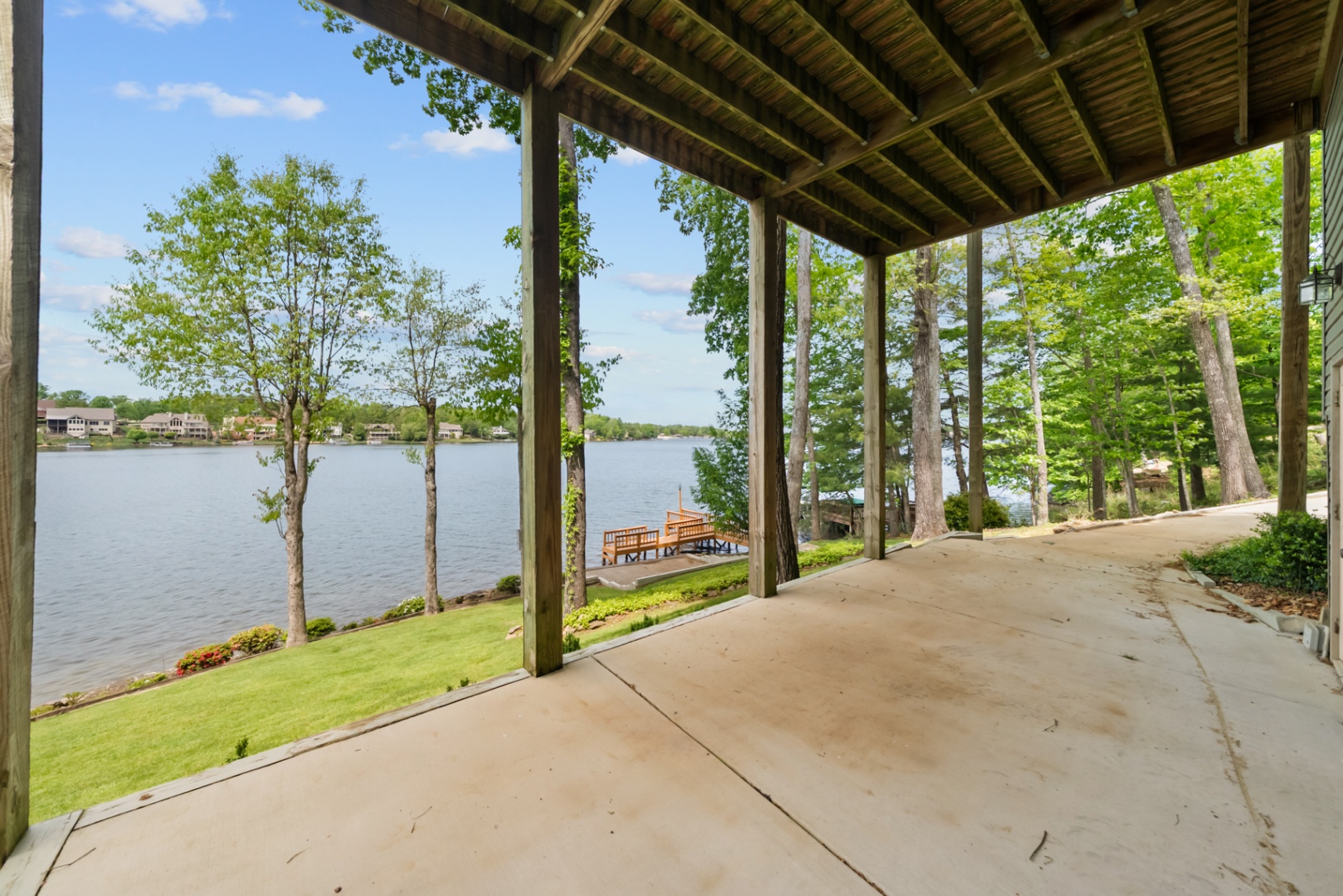 Rear lower-level garage bay and covered lake equipment area
