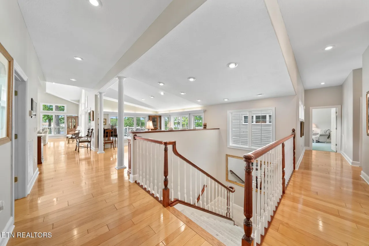 Great room with vaulted ceiling, fireplace, and built-ins